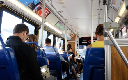 inside view of a MetroBus, showing riders in their seats