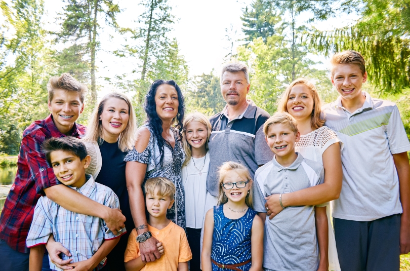 portrait of a large family blended by marriage, including mom, dad, and nine children
