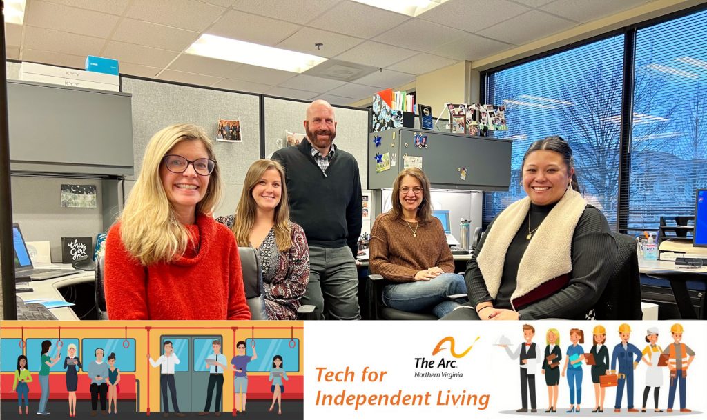 group photo of the Tech for Independent Living staff, posed in an office cubicle space